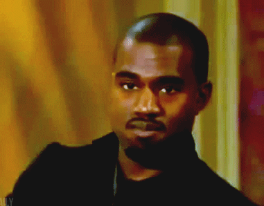 Celebrity gif. Musician Kanye West slowly shakes his head in a disapproving negative.