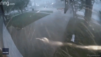 Security Camera Captures Storm Winds Blowing Trash Cans Down Topeka Sidewalk