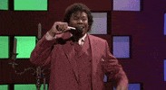 SNL gif. Kenan Thompson, as talk show host Diondre, pumps his fist in victory and says, “Oh yea!”