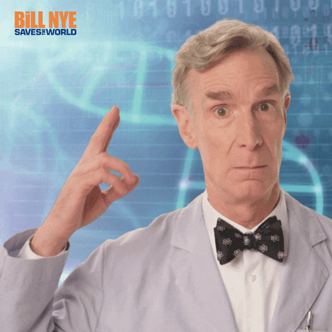 TV gif. Bill Nye as Bill Nye the Science Guy gestures toward his own head and loops his finger in a gesture implying wacky thinking.