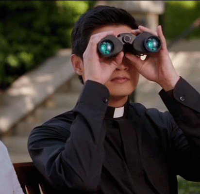 TV gif. Rene Gube as Father Brah in Crazy Ex-Girlfriend peers through binoculars before dejectedly setting them down and saying, "nope...," which appears as text.