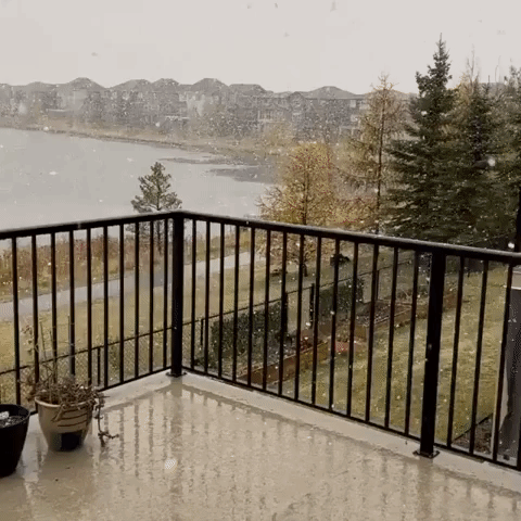 'First Snow' Falls Over Lake in Alberta Town