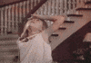 Movie gif. Mary-Kate Olsen as Amanda in It Takes Two presses the back of her hand to her forehead and faints, falling theatrically to the floor at the bottom of a fancy staircase.