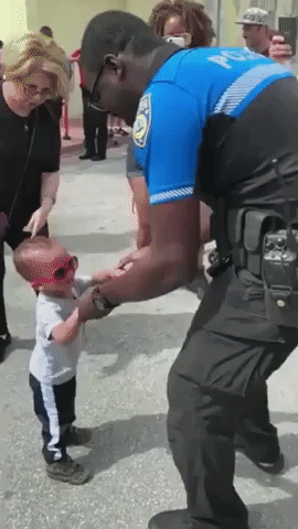 Miami Beach Policeman Dances With Little Boy at Annual Block Party