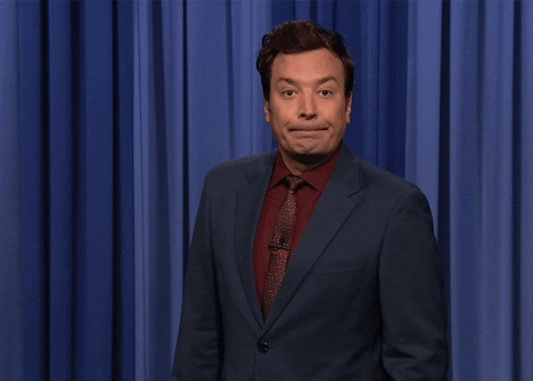 TV gif. Jimmy Fallon as host of the Tonight Show stands in front of a set of blue curtains during his monologue and puts his hand to his chest exclaiming what the text reads, "Personally, I'm shocked!" 