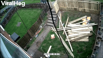 Guy Tearing Down Fence Takes a Tumble