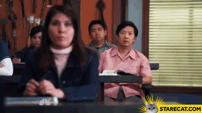 TV gif. Ken Jeong as Ben in Community places his hands to the side of his mouth and yells from the back of a classroom. Large text scrolls across the screen, "Ha! Gay"