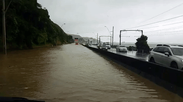 Car Navigates Flooded Motorways in Wellington