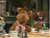 Muppets gif. Fozzie Bear drops his head into his hand, covering his eyes and looking annoyed.