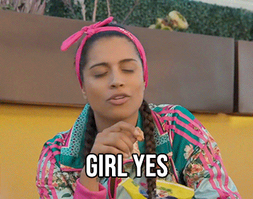 Celebrity gif. Lily Singh wearing brightly colored clothes snacks on chips while sassily agreeing with a smirk on her face, saying “girl yes."
