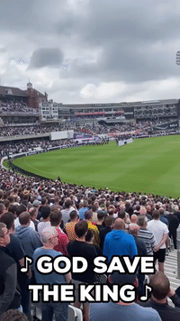 Crowd Sings God Save the King at Cricket Match