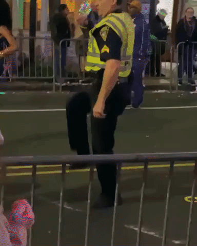 Police Officer Shows Off Dance Moves at Mardi Gras Parade in Mobile, Alabama