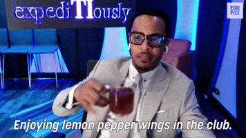 Enjoying Lemon Pepper Wings In The Club