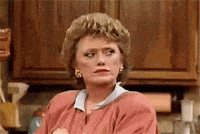 TV gif. Rue McClanahan as Blanche on The Golden Girls looks over at someone, looking them up and down with furrowed eyes.