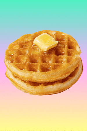 Photo gif. A photo of two waffles topped with a pat of butter and syrup skates up and down over a tie-dye background.