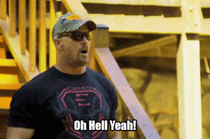 Reality TV gif. Steve Austin from Redneck Island rubs his hands together in anticipation, declaring "Oh hell yeah!"