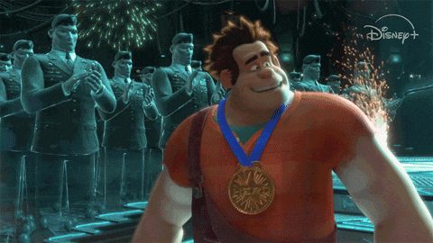 News MEI - Edição 19 - GIF de animação da Disney de homem, com uma medalha, descendo escadas e mandando beijos enquanto é aplaudido por uma plateia.