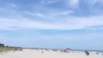 Beachgoers Watch SpaceX Falcon 9 Rocket Land in Florida