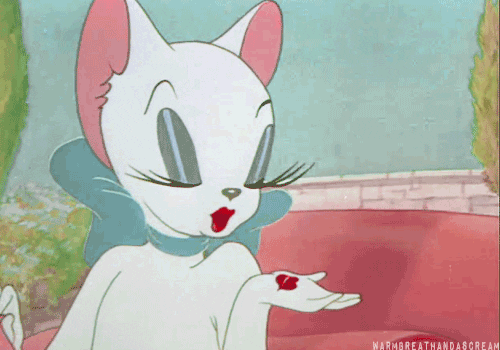 Cartoon gif. A vintage cartoon white cat with long, soft eyelashes closes her eyes and puckers her red lips. She has her hand up to her face as she holds a small red lipstick stain in her palm. She blows lipstick stain away and it flies away in the wind. She literally blew someone a kiss.