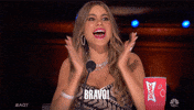 Reality TV gif. Sofia Vergara on America’s Got Talent claps enthusiastically. Text, “Bravo!”