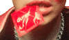 Music video gif. Close-up of Yungblud's mouth, clenching the corner of a red Durex condom with his teeth.