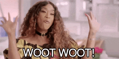 Reality TV gif. Tami Roman in Basketball Wives exclaims in a playful celebration while pumping her hands in a "raise the roof" motion. Text, "Woot woot!"