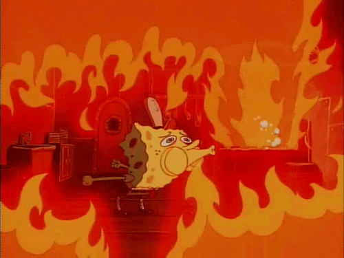 SpongeBob gif. Flames from the grill are filling the kitchen of the Krusty Krab. SpongeBob desperately tries to blow out the fire, but it doesn't have any effect.