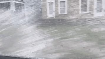 Water Splashes Up Side of Car as Ohio Road Floods