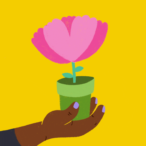 Cartoon gif. An outstretched hand with lavender nail polish holds a potted pink flower. The flower's petals split apart in a burst of hearts and butterflies as the words "Thank you" appear from the split.