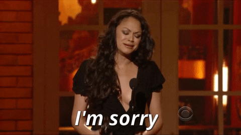 Celebrity gif. Karen Olivo stands on stage with an award in her hand. She closes her eyes and covers her mouth as she sobs and says, “I’m sorry.”