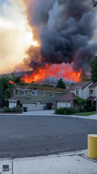 Wall of Flame Burns Behind Homes as Blue Ridge Fire Bears Down on Chino Hills, California