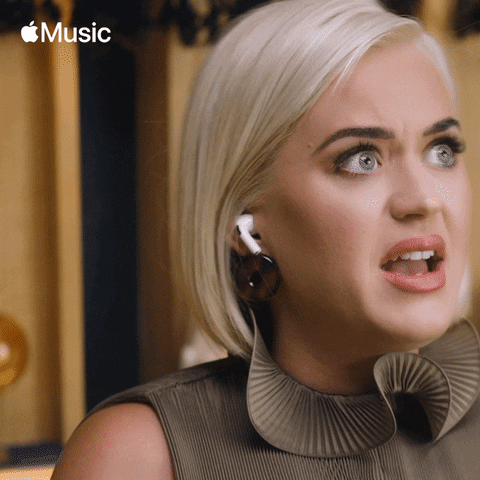 Ad gif. Wearing Air Pods, Adele looks off to the side and straightens herself as if she just realized something surprising.