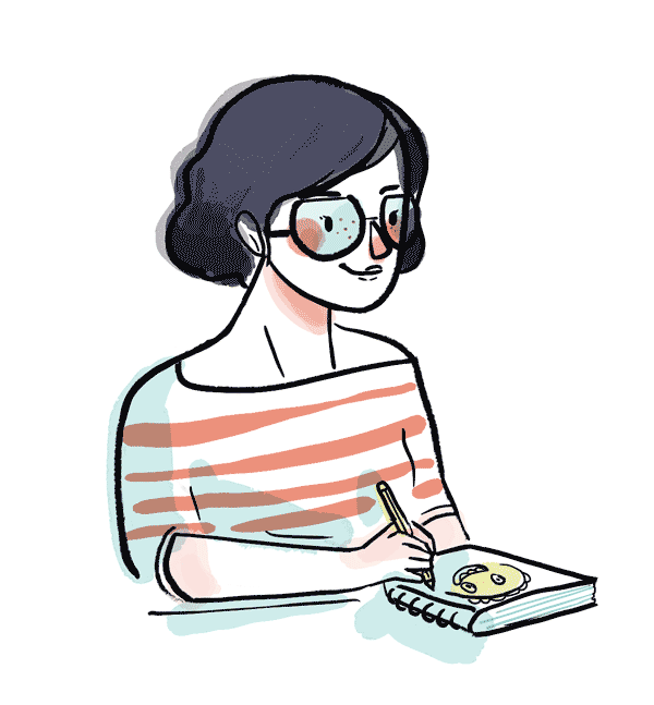 a woman with black hair, glasses and freckles drawing a smiling face in her sketch book 