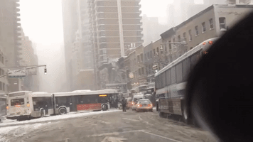 New York City Buses Jackknife on Snowy Roads