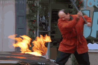 Seinfeld gif. Jason Alexander as George frantically whacks the hood of a car on fire with a rake.