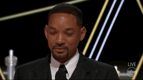 Celebrity gif. Will Smith, at the Academy Awards, shakes his head as tears roll down his face while accepting an award.