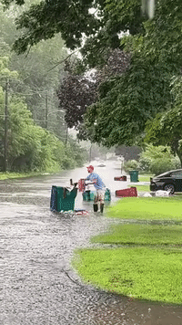 'Are You Kidding Me?': Cleanup Effort Interrupted by Driver Along Flooded Street