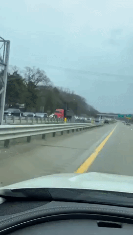Line of Vehicles Jams Michigan Highway During Protest Against Stay-At-Home Order
