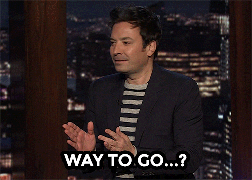 TV gif. On The Tonight Show, a confused Jimmy Fallon slow claps uncertainly and stutters, “Way to go?”