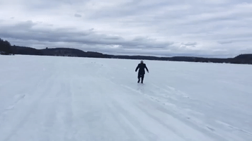 Man Takes Icy Tumble While Chasing His Hat