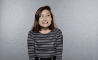 awkward smile GIF