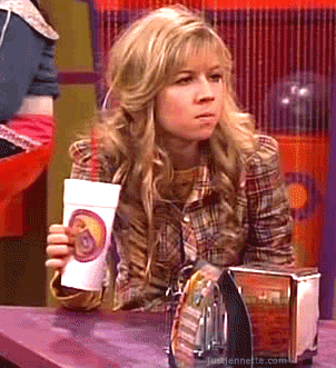 TV gif. Jennette McCurdy as Sam Puckett on iCarly frowns and squeezes her styrofoam cup until it bursts open, spilling out red juice.