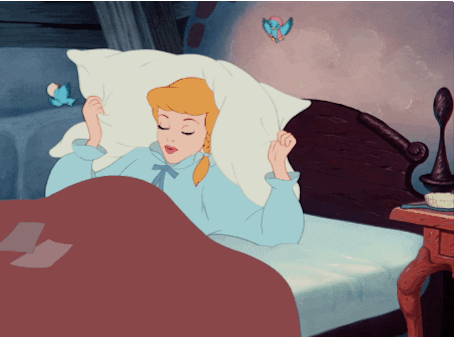 Disney gif. The classic animated Cinderella rolls over in bed face down as she pulls the pillow over her head.