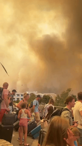 Rhodes Holidaymakers Flee as Firefighting Aircraft Tackle Wildfires