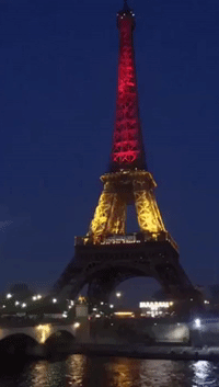 Eiffel Tower Illuminated in Belgian Colors in Solidarity of Victims of Brussels Attacks