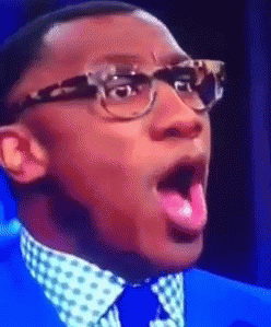 Celebrity gif. Closeup of Shannon Sharpe as his eyes go wide in shock and he exaggeratedly mouths, "Whoa."