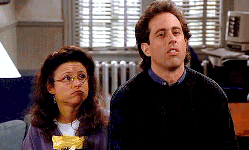Seinfeld gif. Jerry Seinfeld as Jerry and Julia Louis-Dreyfus as Elaine give us synchronous shrugs that seem to say "I don't know and I don't care."