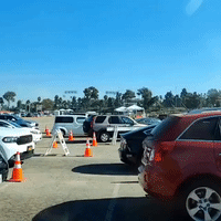 Long Lines of Cars Wait at Dodger Stadium Drive-Thru COVID-19 Testing Center