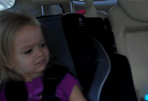 Meme gif. Young blonde girl, Chloe, in a car seat looks at us with a judgmental or disapproving side-eyed expression, darting her eyes back and forth like she doesn't get what you're about at all.