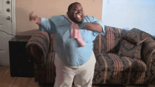 Video gif. Man dressed like Carlton from the Fresh Prince of Bel-Air, dances like Carlton with a joyous open smile, swinging his arms side to side.